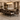 Dining room with a wooden table and chairs, featuring a chandelier and decorative elements.