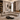 Modern living room with a sectional sofa, coffee table, and decorative elements.