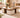 Wooden coffee table with decorative items in a living room setting