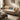Beige sofa with decorative pillows in a living room setting, featuring the brand 'Mohkan'.