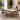 Dining room with a wooden table and chairs, featuring the brand 'Mohkam'.