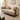 Beige sofa with decorative pillows in a stylish living room setting, featuring the Mohak brand.