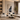 Modern living room with a sectional sofa, coffee table, and decorative elements.