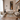 Luxurious living room with beige sofas, ornate coffee table, and decorative wall art.
