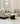 Modern living room setup with a sofa, armchair, and coffee table in a stylish interior.