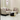 Modern living room setup with a sofa, armchair, and coffee table in a stylish interior.